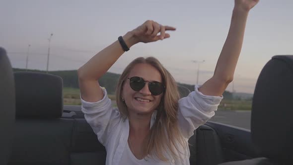 Girl Dancing in the Car