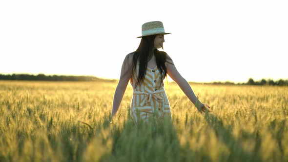 Woman Walking in a Field with Open Arms