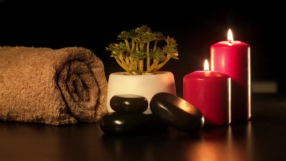 Towel Hot Stones and Candles for Relax Spa Massage and Body Treatment