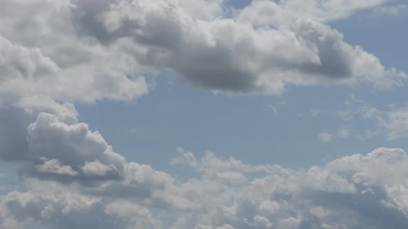 Clouds Are Moving Against the Blue Sky