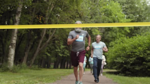 Happy Aged Man Winning Marathon Run