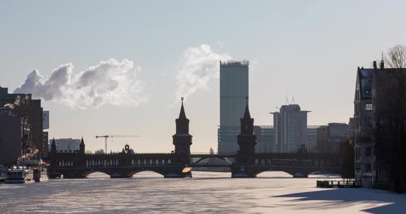 Early morning time lapse of the Oberbaum bridge with ice and clouds