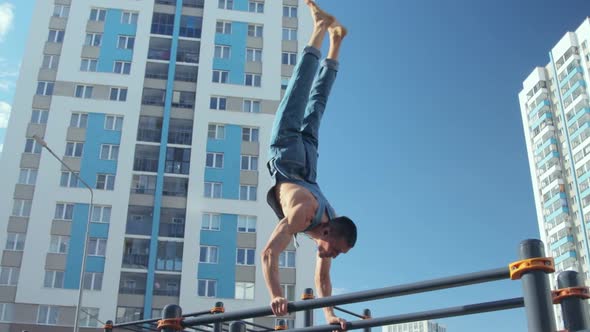 A man exercising on a sports ground