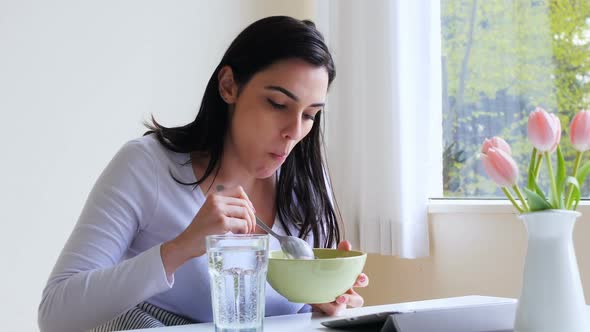 Beautiful woman having breakfast