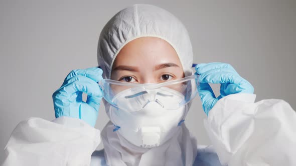 doctor wearing medical face mask and protective glasses
