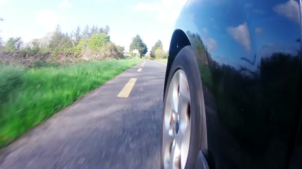 Speedy car moving on a country road 4k