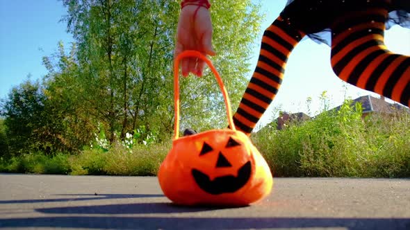 Child Girl in Costume Celebrates Halloween