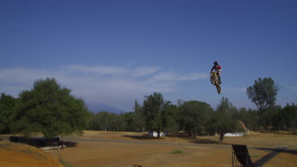 Motocross rider going off big jump, slow motion, 4K shot on RED Epic