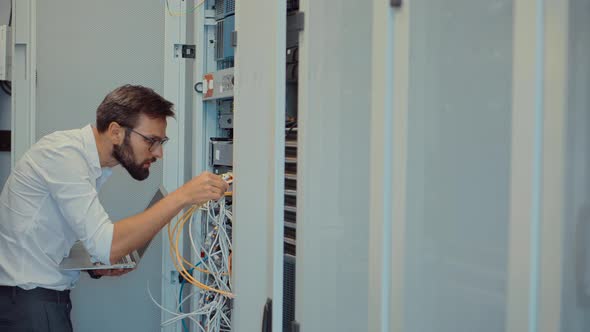 Technician Testing Network Connection. Hardware Updates On Server Room. Engineer Connect Network.