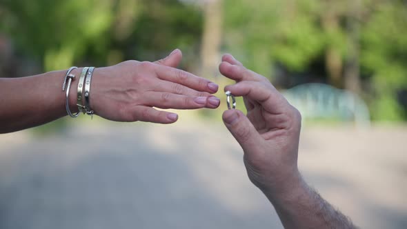 Marriage Proposal Man in Love Puts Diamond Ring on an Happy Woman Closeup