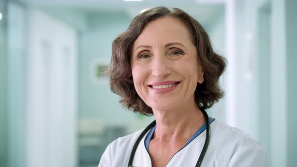 Smiling Female Happy Doctor Pediatrician Nurse in Clinic Hospital