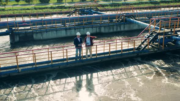 Male Businessmen Discussing a Cleaning Facility