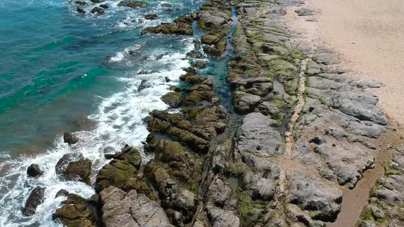 Aerial footage showing the beach and waves in Cachagua, Chile