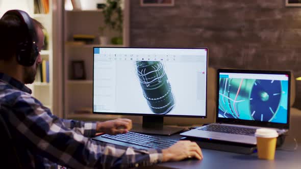 Side View of Engineer Wearing Headphones and Working on a Turbine