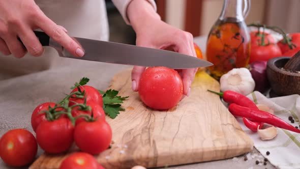 Woman Making Cuts for Tomato Blanching