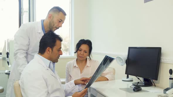 Experienced Doctors Tell the Patient the Results of an X-Ray