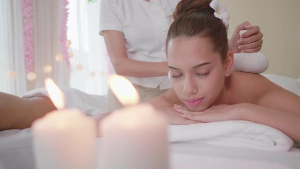 Beautiful Young Woman Massage Multiethnic women relaxing at spa center with a therapy.