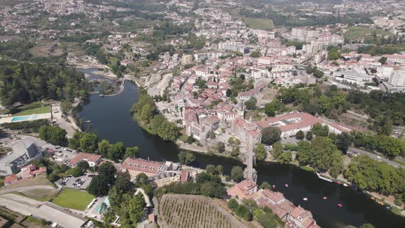 Aerial above view of the historic parish townscape and famous Sao Goncalo church, Amarante.