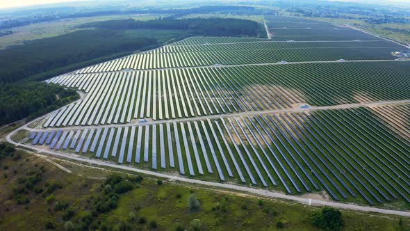 Aerial View of Huge Powerful Station with Solar Panels Generates Electric. Industrial Solar Energy