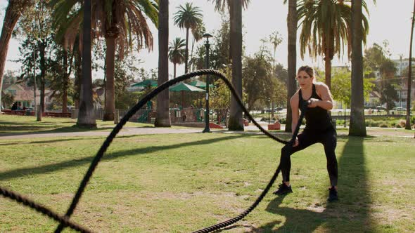 Very Athlete Woman Works Out In The Park