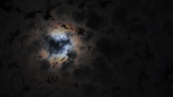 Full Glowing Yellow Moon with Clouds Being Blown By Winds During Storm at Nights