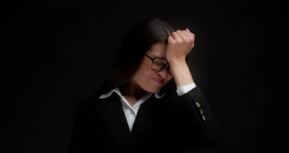 Business Woman Has Forgotten Something Holding Her Fist to Her Forehead