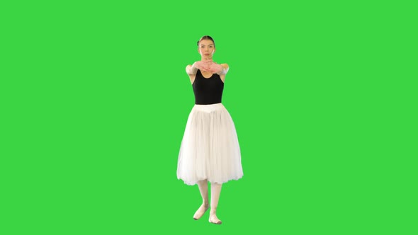 Young Ballerina Walks Warming Up Her Joints on a Green Screen Chroma Key