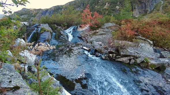 Beautiful autumn colors in the mountains of Austria, waterfall in slow motion 120fps