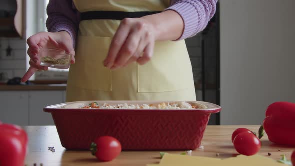 Woman Is Adding Mix of Spices to Meal