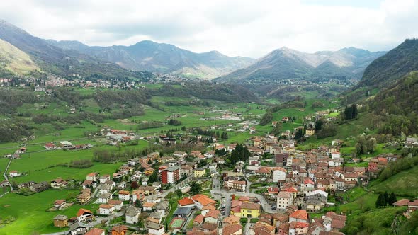 Aerial Video of the Small Town of Pasturo in Lombardy North Italy Showing Mountain Panorama Forest