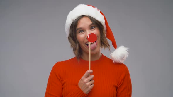 Woman in Santa Helper Hat Having Fun on Christmas