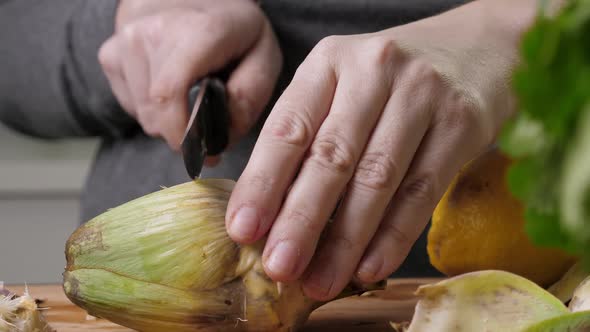 Woman Cut Artichoke