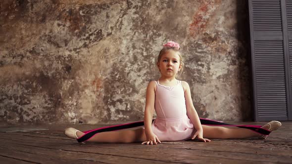 Kid Girl Gymnast Sitting in the Splits