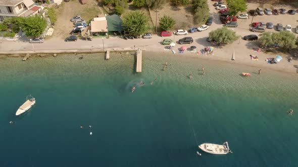 Aerial pan out view of beach in Greece.