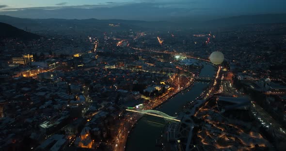 Aerial view of Tbilisi city central park and Bridge of Peace. Beautiful cityscape of old Tbilisi