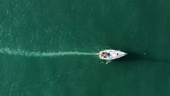 Drone Footage of a White Motor Boat with Portuguese Flag and Tourists