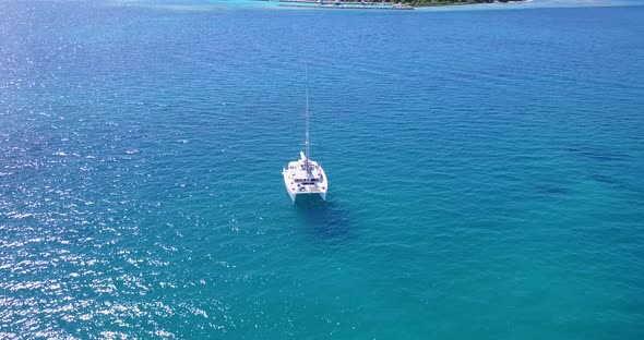 Natural fly over copy space shot of a paradise sunny white sand beach and blue ocean background 