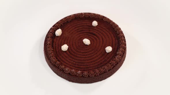 Fresh Chocolate Tart with Tasty Decorations on White Table