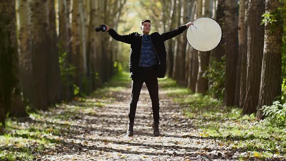 Against the Backdrop of the Autumn Color Park Photographer Jumps in Rapid Shoot