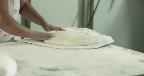 Baker Put The Kneaded Dough On The Divider Rounder Plate And Sprinkle With Wheat Flour. Bun Divider