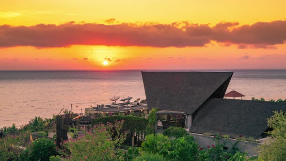 Traditional Balinese Roof in Shadows with the Backdrop of the Setting Sun Reflecting on the North