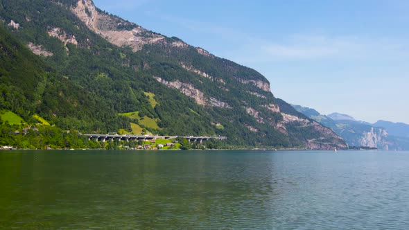 Road infrastructure in Switzerland. Automobile bridge passing along the Alpine mountains.