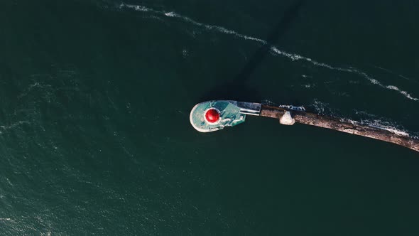 Aerial Top View of White Lighthouse Near Sea Port