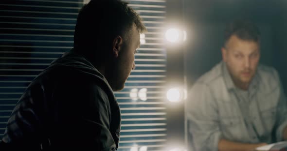 Actor Rehearsing Lines in Front of Mirror