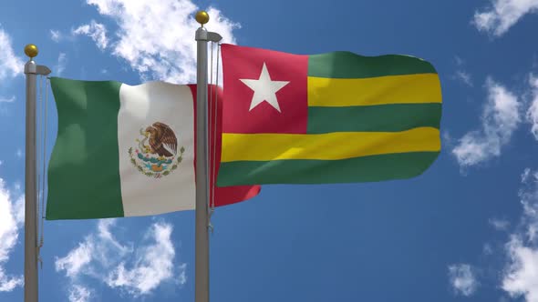 Mexico Flag Vs Togo Flag On Flagpole