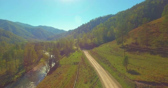 Low Altitude Flight Over Fresh Fast Mountain River with Rocks at Sunny Summer Morning.