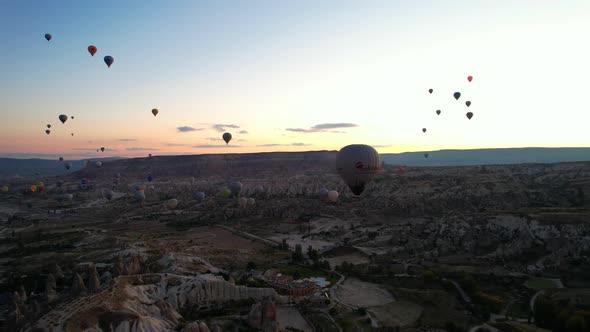 Colorful Hot Air Balloons Flying Over the Valleys