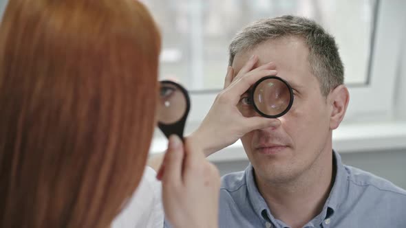 Optometrist Checking Patient’s Eyes