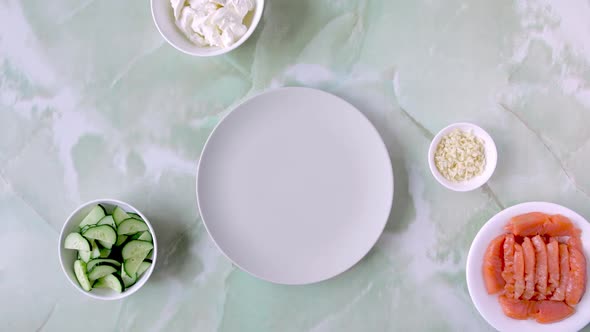 Woman Putting Ingredients on the Table One By One to Cook Pancakes with Red Fish