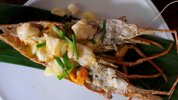 Seafood Restaurant  Fresh Full Red Lobster with Cooked Meat on Wooden Table